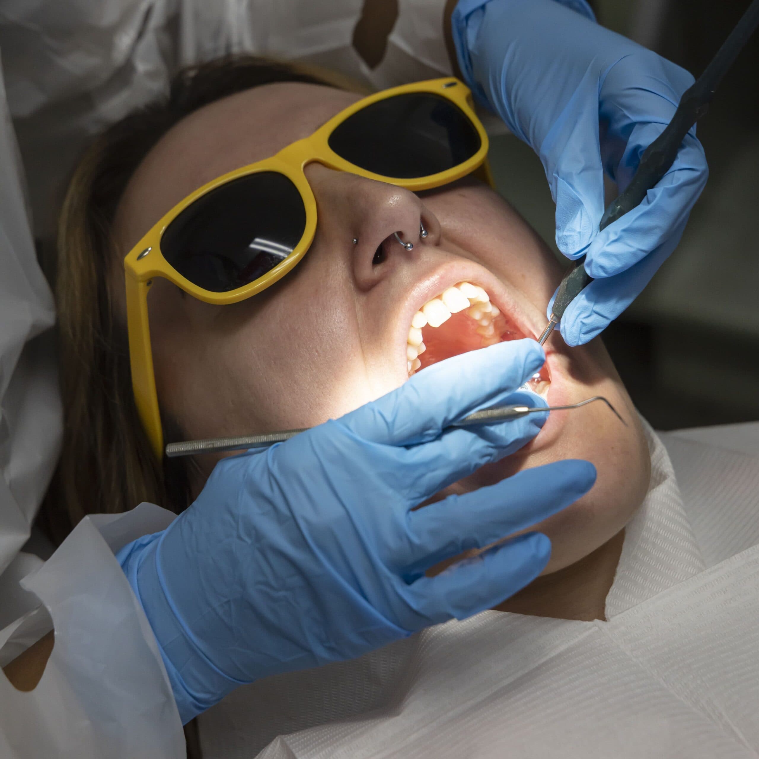 A West Road Dental clinician treating a patient wearing protective eyewear